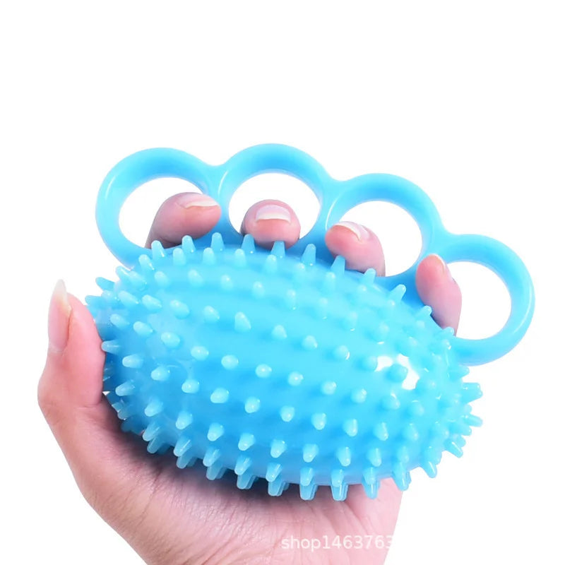 Pelota de entrenamiento ortopédico para la rehabilitación de dedos y manos, con anillo de sujeción.