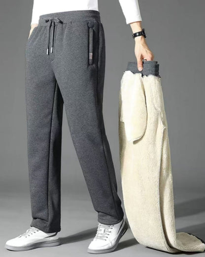 👖【M-5XL】Zimowe męskie spodnie sportowe na zimę 2025 z grubym ociepleniem z futerka owczego, casualowe, ciepłe i komfortowe.