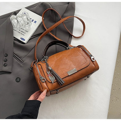 👜Bolso bandolera para mujer con diseño de borlas de estilo retro y patchwork de color liso, 2026