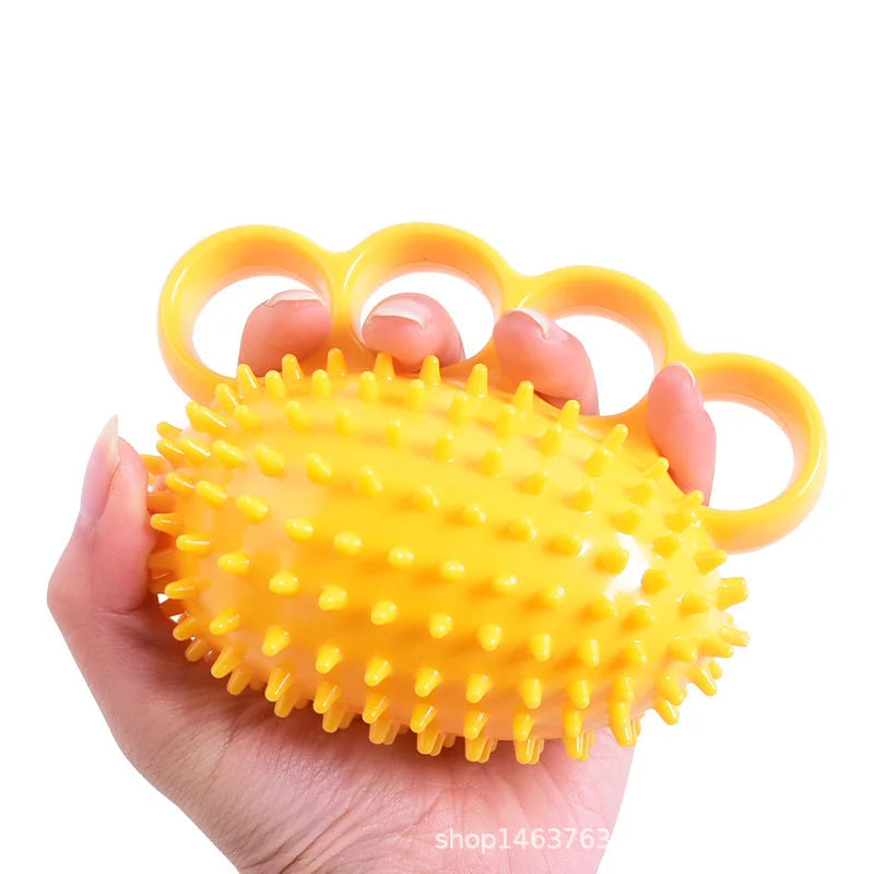 Pelota de entrenamiento ortopédico para la rehabilitación de dedos y manos, con anillo de sujeción.