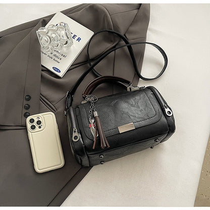 👜Bolso bandolera para mujer con diseño de borlas de estilo retro y patchwork de color liso, 2026